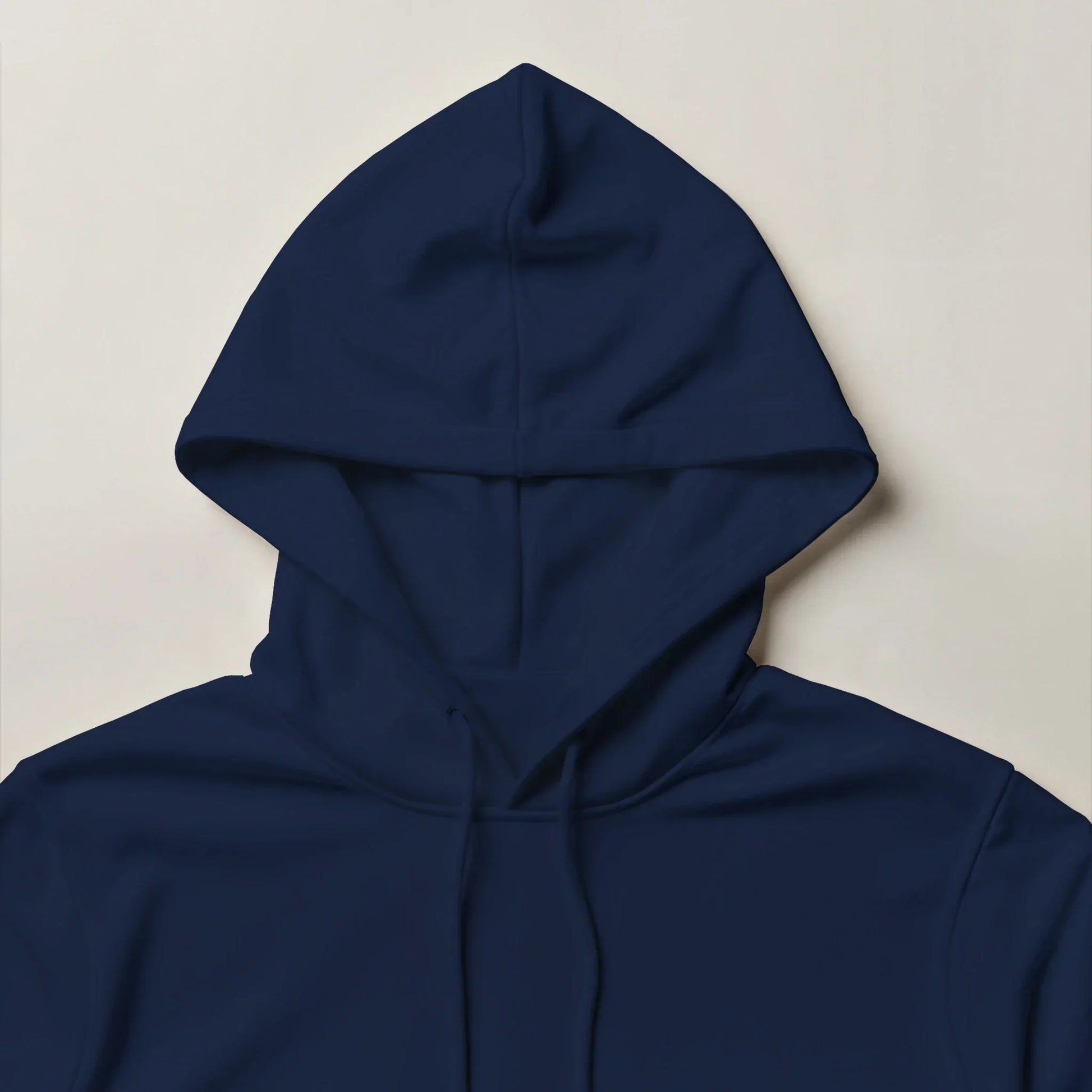 Dark blue unisex hoodie with drawstring hood on light background, streetwear style