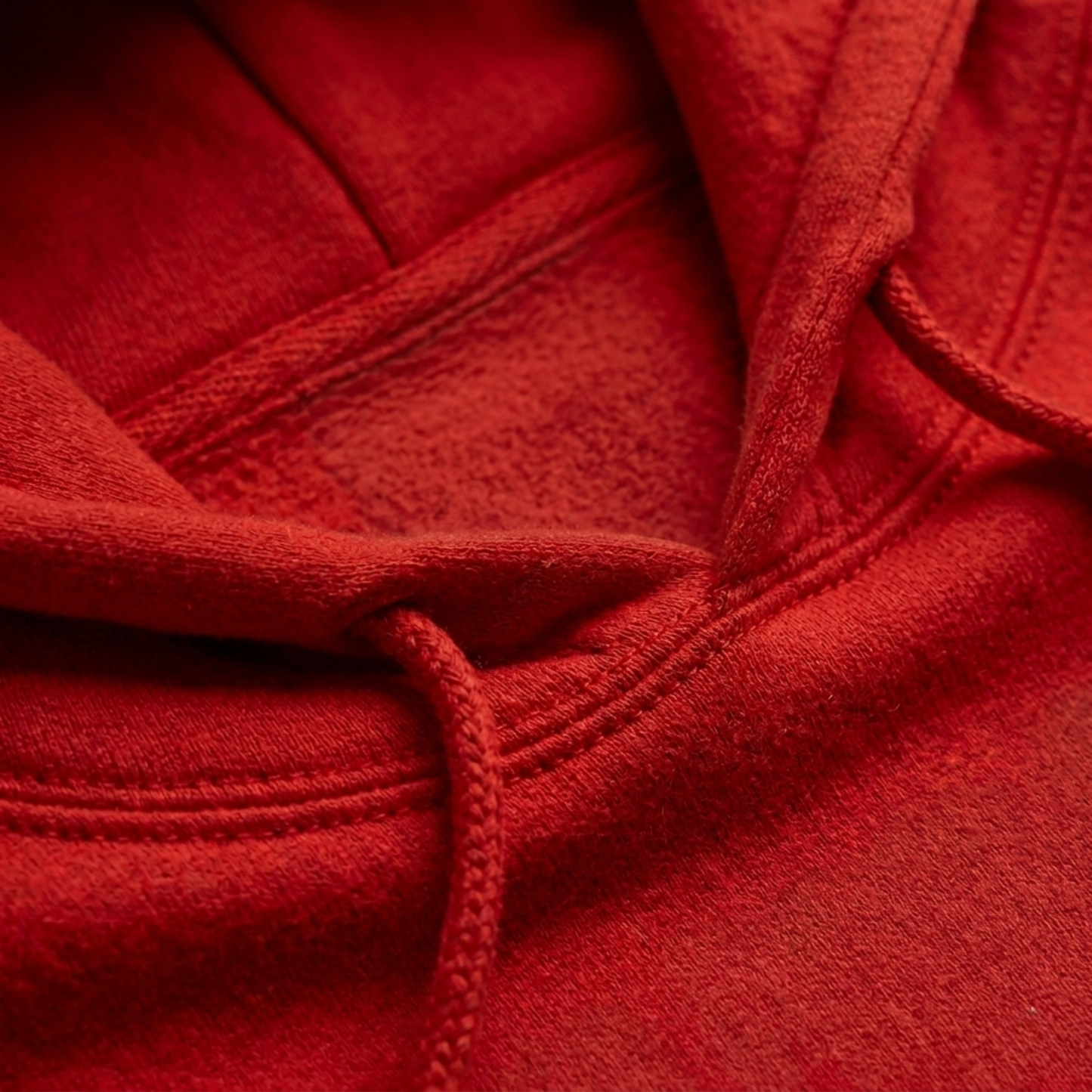 Close-up of the Everglow: True Strength – Grow Slowly hoodie, showcasing the hood, drawstrings, and stitching. The soft, textured fabric and cozy fleece lining highlight its classic unisex fit.